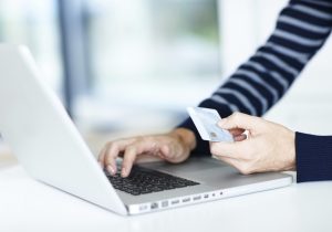 A woman trying to charge credit cards online